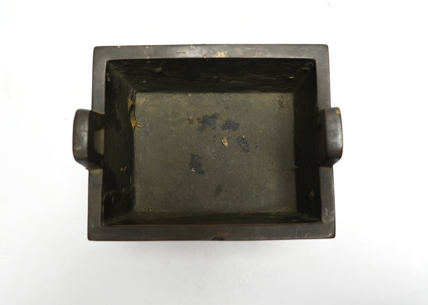 A Chinese archaistic bronze censer, fangding, Ming dynasty, repairs, 20cm